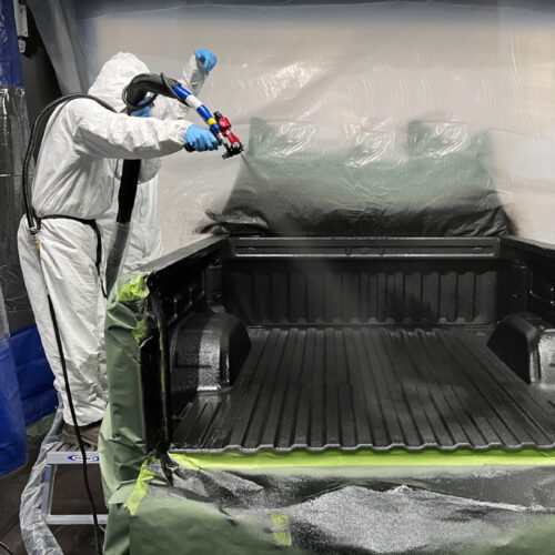 polyurea spray coating a truck bed